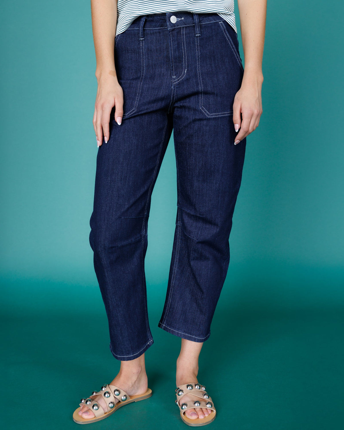 Downeast super high rise barrel-leg denim jeans displayed on a model, showcasing the relaxed fit and stylish design.