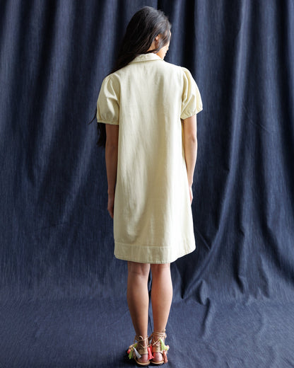 Downeast Demure denim dress featuring a classic fit with long sleeves and button front, styled for casual wear.