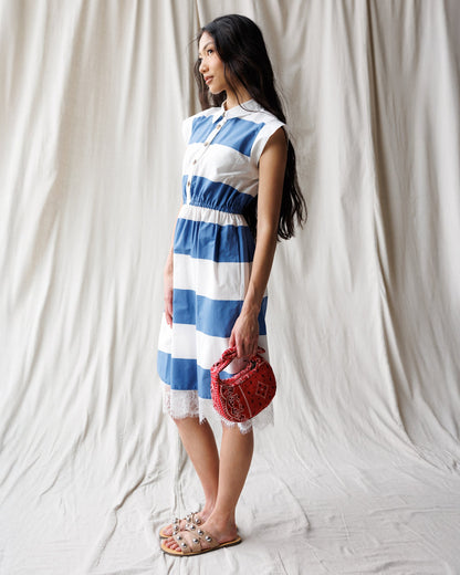 Downeast Hamptons Dress, casual sleeveless summer dress with floral print and relaxed fit, displayed on a hanger.