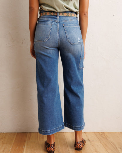 Downeast super high wide cropped denim utility pants displayed on a hanger, showcasing the relaxed fit and distressed details.