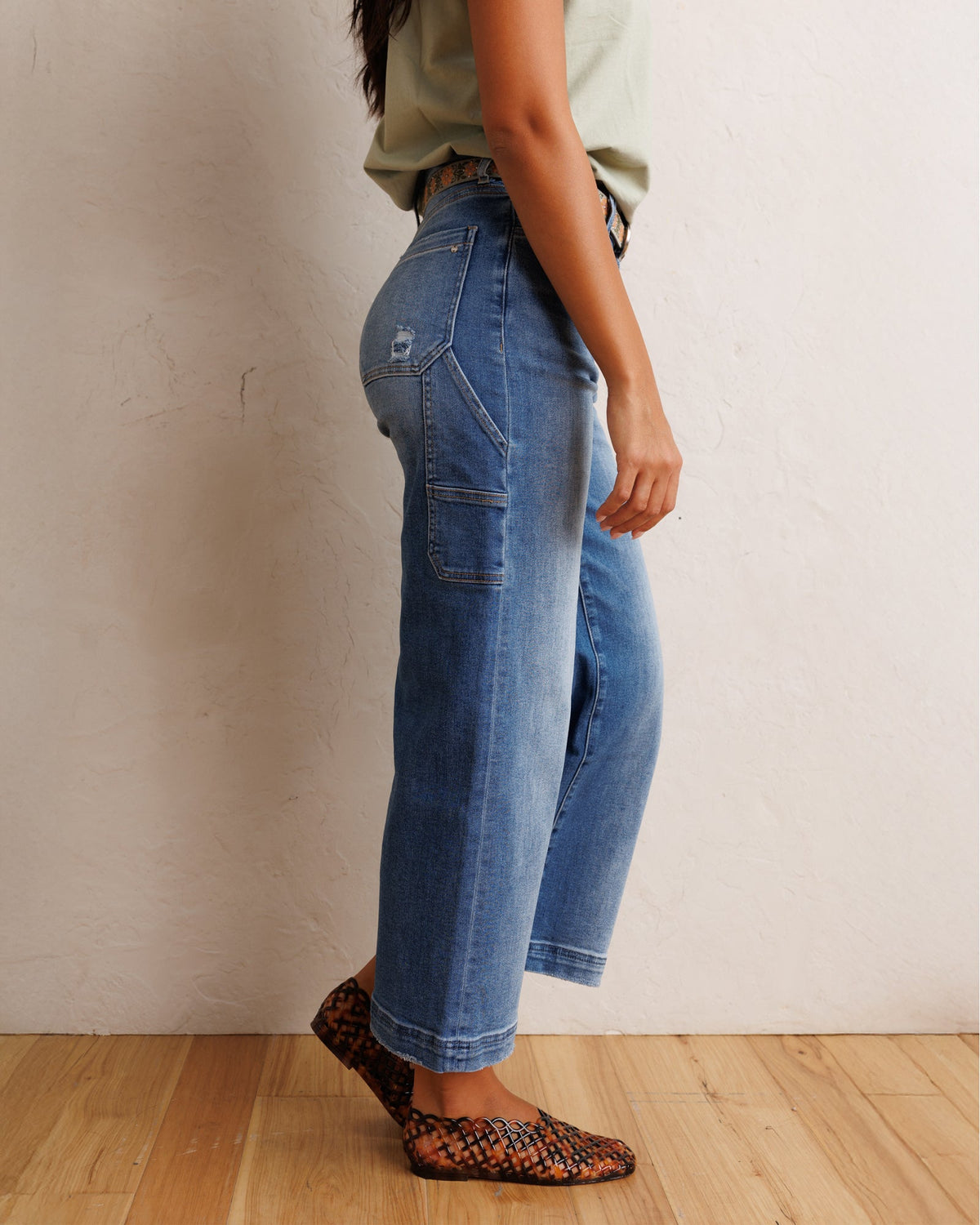 Downeast Super High Wide Cropped Denim Utility pants displayed on a model, showcasing their relaxed fit and stylish design.