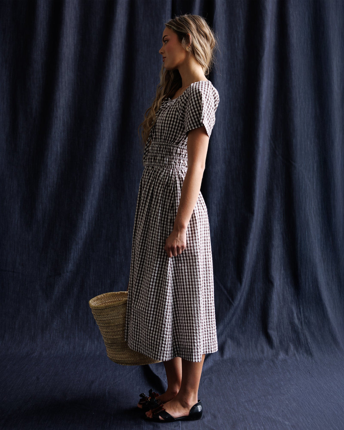 Downeast Maybelle Dress featuring a flowing fabric and floral pattern, showcased on a hanger against a neutral background.
