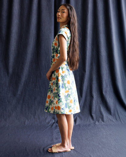 Downeast Newberry Dress featuring a floral pattern and lightweight fabric, displayed on a hanger against a neutral background.