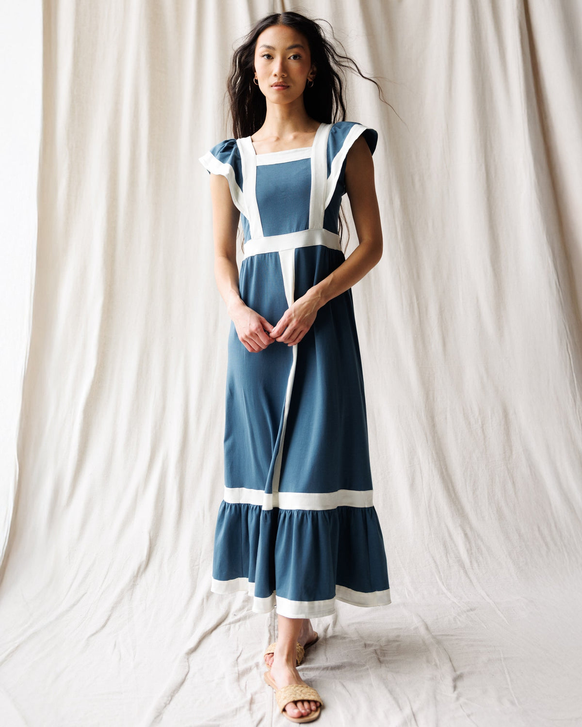 Downeast Block Party Dress displayed on a hanger, featuring a vibrant, stylish design perfect for casual or festive occasions.