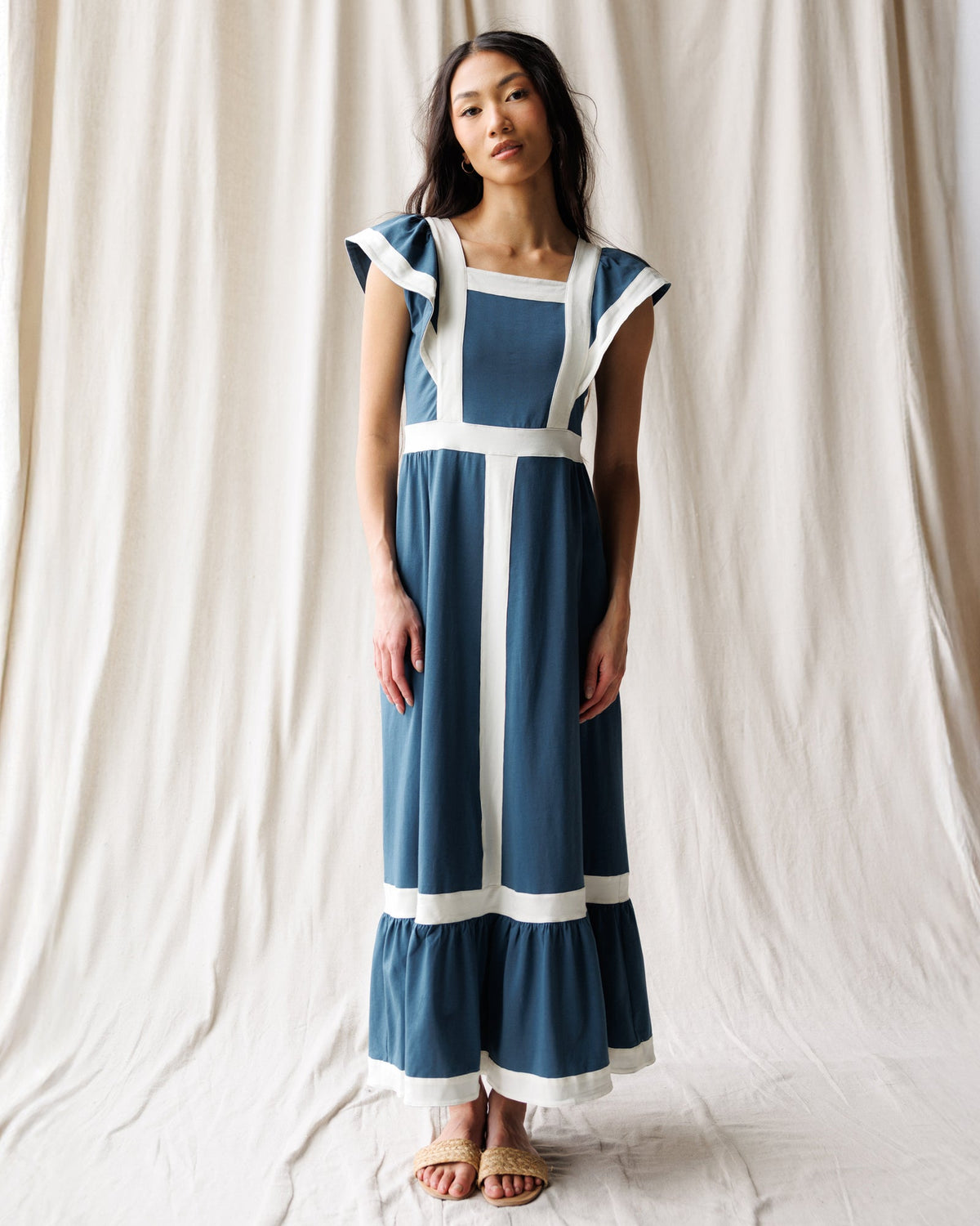 Downeast Block Party Dress with colorful floral pattern, sleeveless design, and knee-length fit, perfect for casual summer wear.
