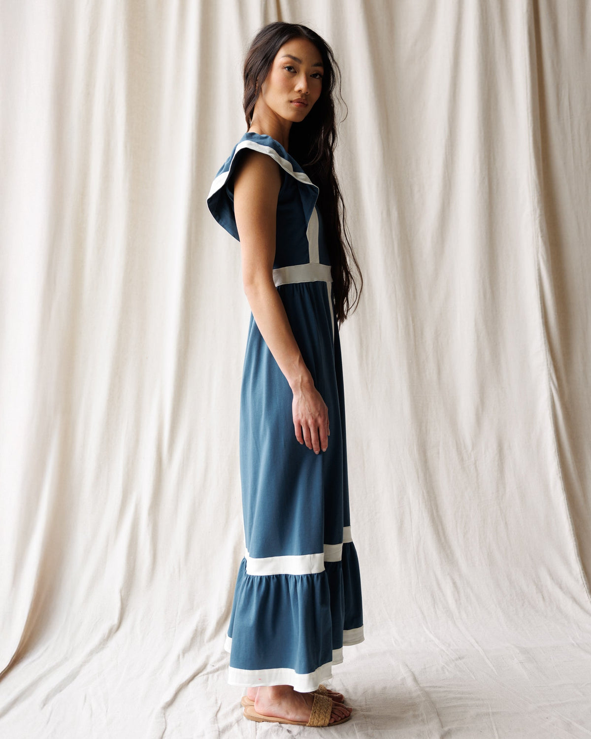 Downeast Block Party Dress in vibrant floral fabric, sleeveless design with a fitted bodice and flowing skirt.