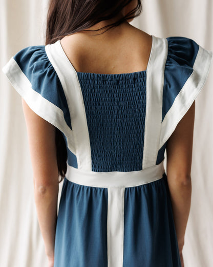 Downeast Block Party Dress displayed on a hanger, featuring a colorful, casual dress with a relaxed fit and stylish design.