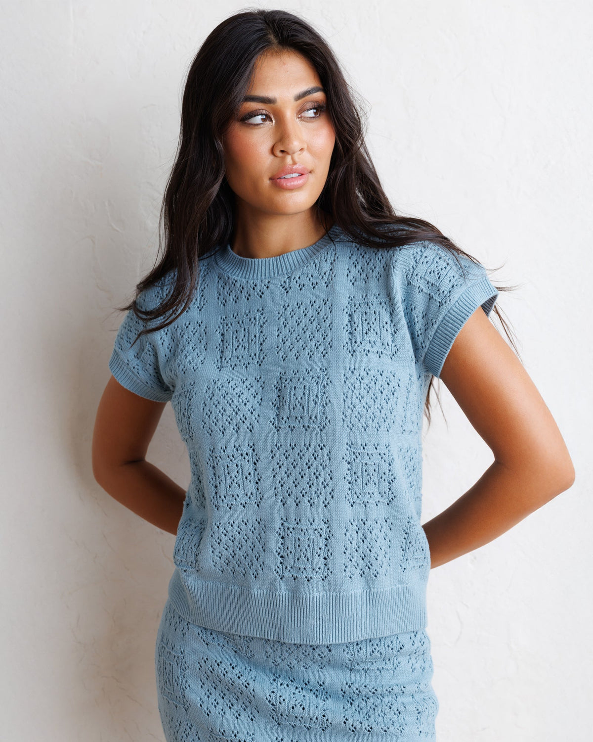 Downeast Frame-Worthy Sweater, cozy knit sweater in neutral tones, displayed on a hanger against a plain background.