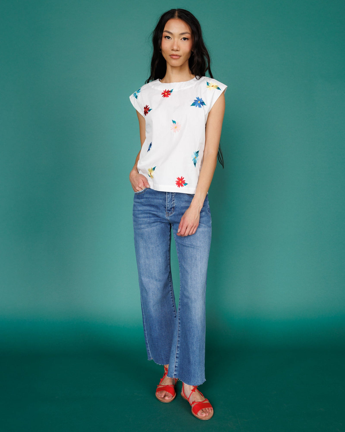 Downeast high rise wide leg denim jeans shown in a natural pose, featuring classic blue wash and relaxed fit.