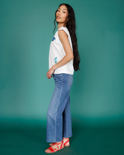 Downeast high rise wide leg denim jeans with a relaxed fit and classic blue wash, displayed on a hanger.