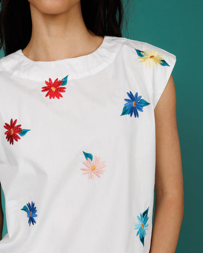 Downeast Flower Farm Top, a stylish women's blouse with floral print and breezy fit, shown on a hanger.