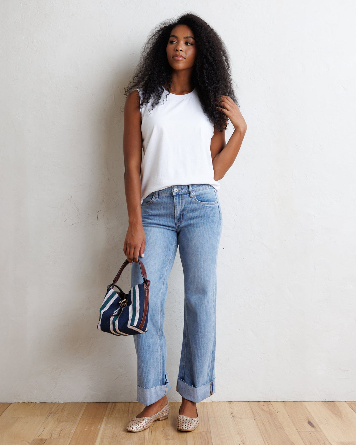 Downeast mid-rise wide stripe denim jeans showing a relaxed fit and stylish blue and white vertical stripe pattern.