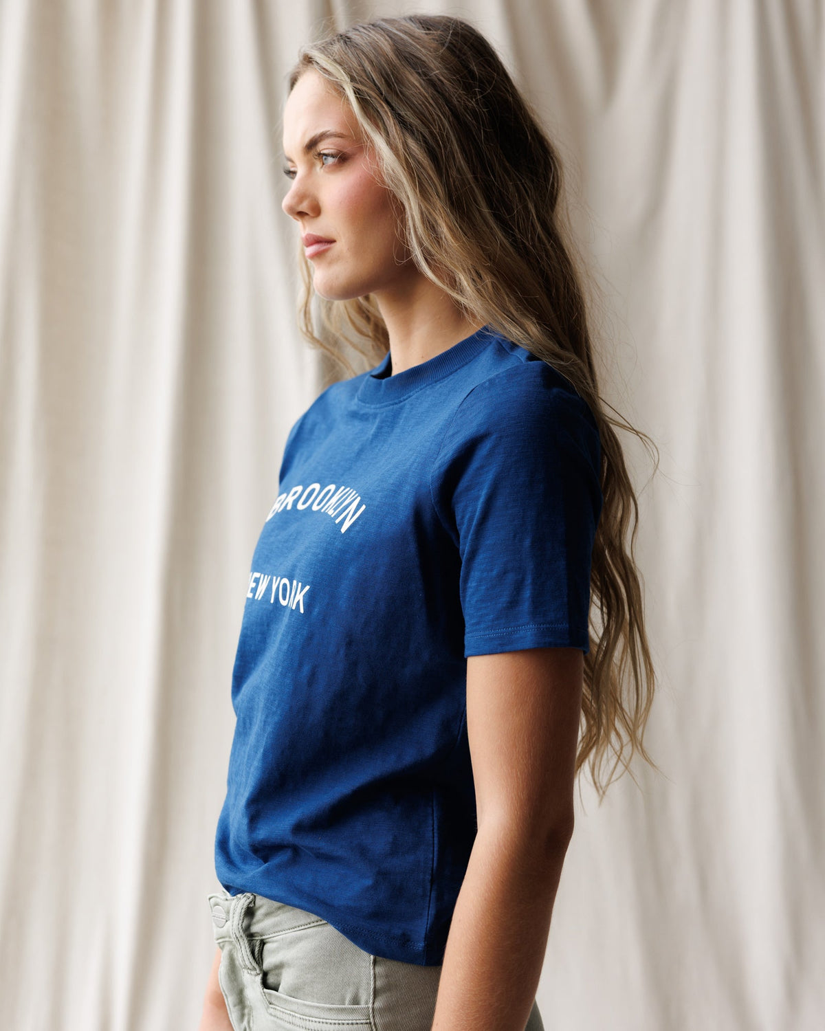 Downeast Brooklyn Tee, a casual women's top in soft fabric with a relaxed fit and short sleeves, shown on a hanger.