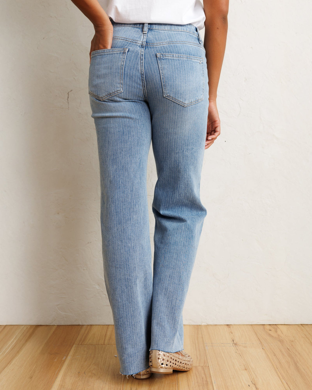 Downeast mid-rise wide stripe denim jeans with a relaxed fit, featuring horizontal blue and white stripes and classic denim details.