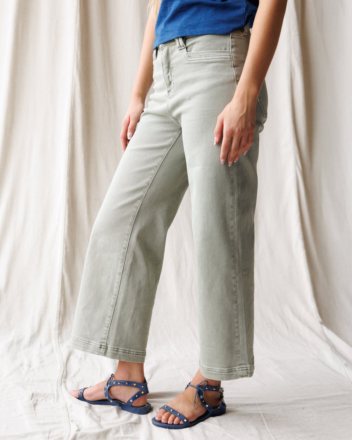 Downeast Super High Wide Cropped Denim Utility Pants displayed on a hanger, showcasing their relaxed fit and stylish utility design.