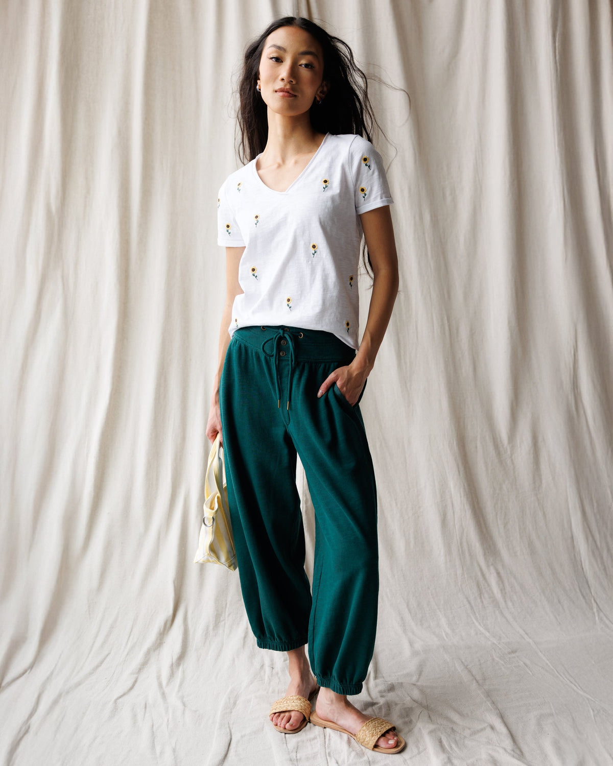Downeast Sunflower Fields Tee featuring a vibrant sunflower design on a casual top, perfect for spring and summer wear.