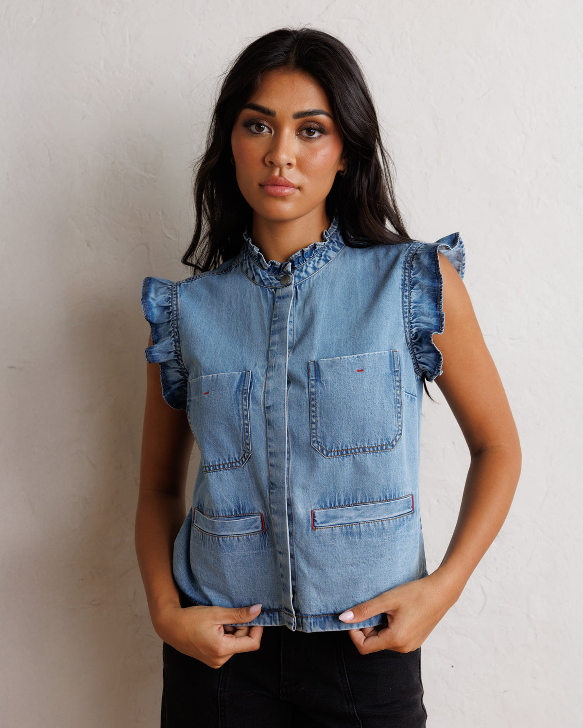 Downeast Day To Day denim vest, stylish outerwear with classic blue denim fabric and button-front design.