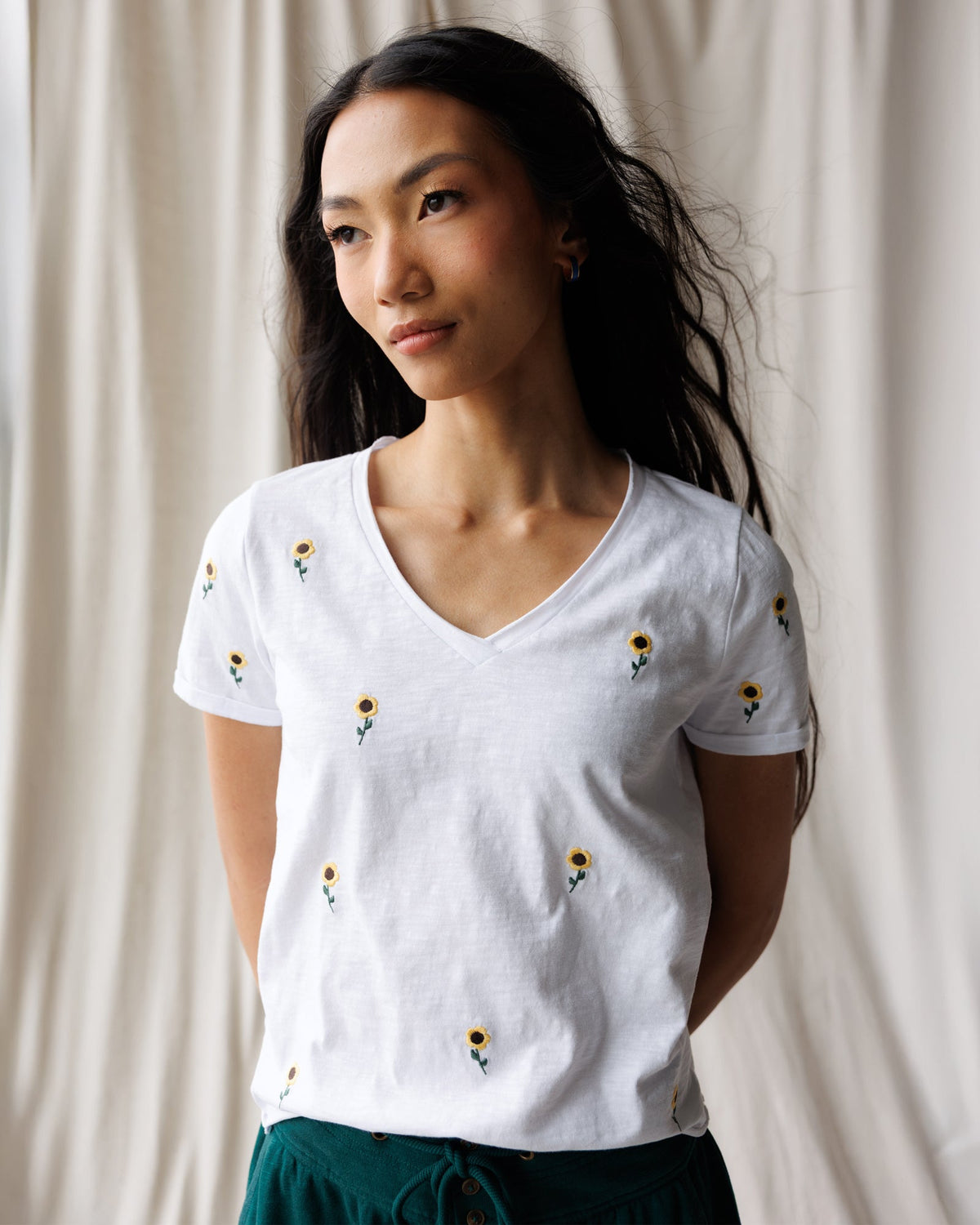 Downeast sunflower fields graphic tee for women, featuring a vibrant sunflower print on a casual top.