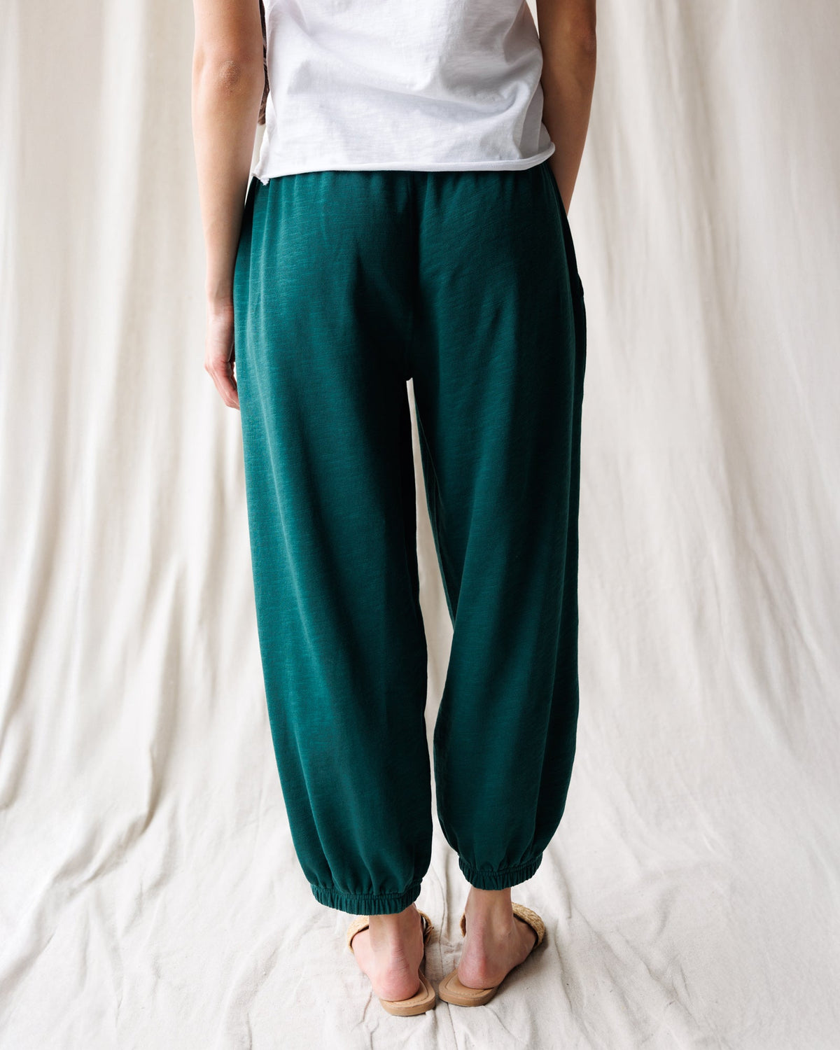 Downeast Cloud 9 joggers, comfortable gray pants with relaxed fit and elastic waistband, shown on a person in a casual setting.