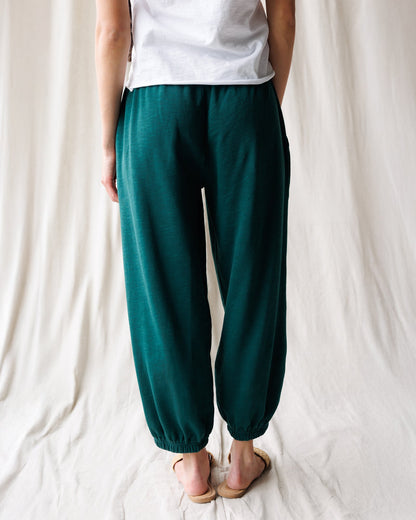 Downeast Cloud 9 joggers, comfortable gray pants with relaxed fit and elastic waistband, shown on a person in a casual setting.