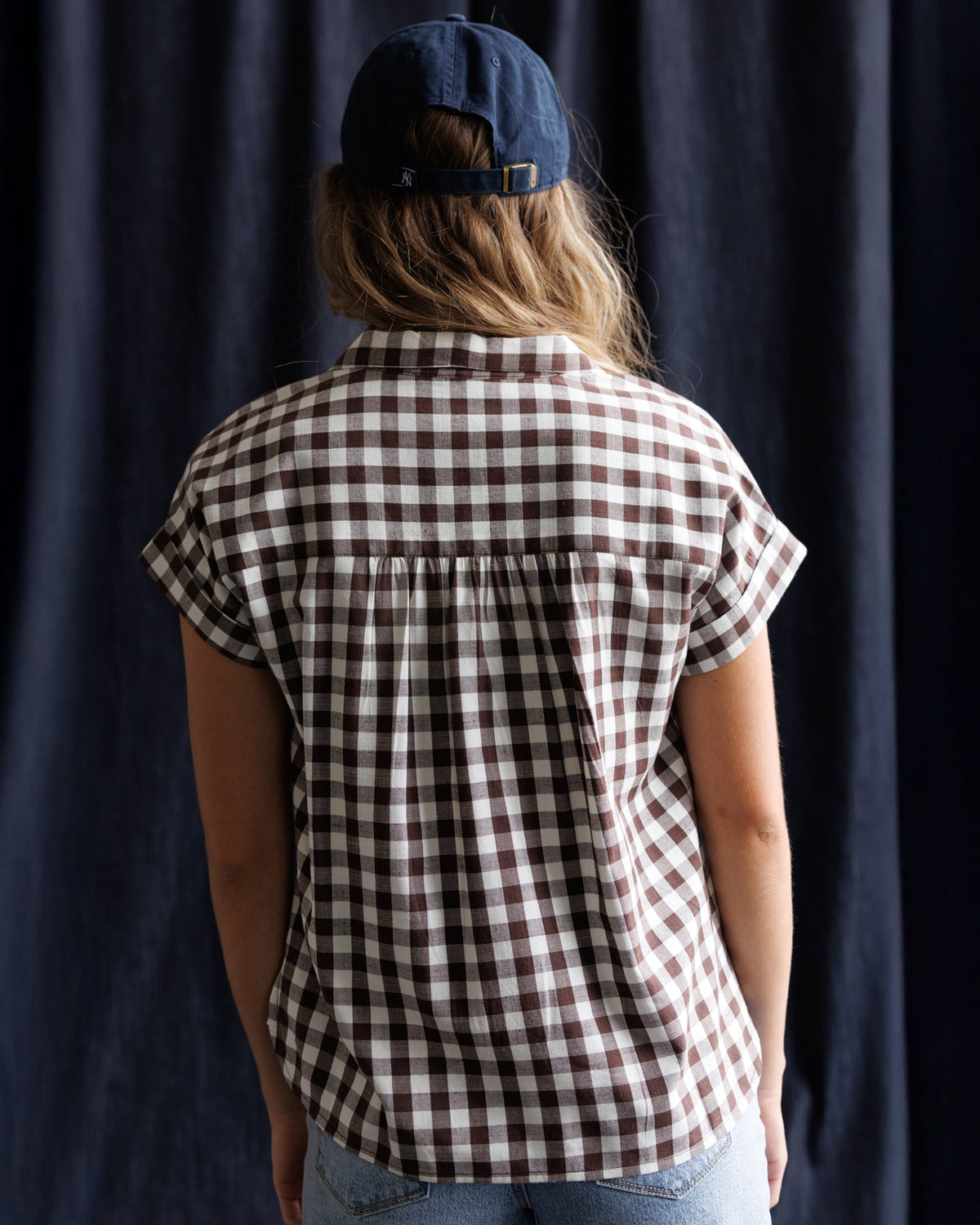 Downeast In Check Top, stylish women's blouse with a checkered pattern, short sleeves, and a relaxed fit.
