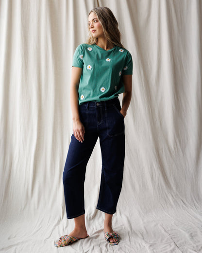 Downeast Pretty Petals Tee, a casual women's top with floral print, displayed on a hanger in a retail setting.