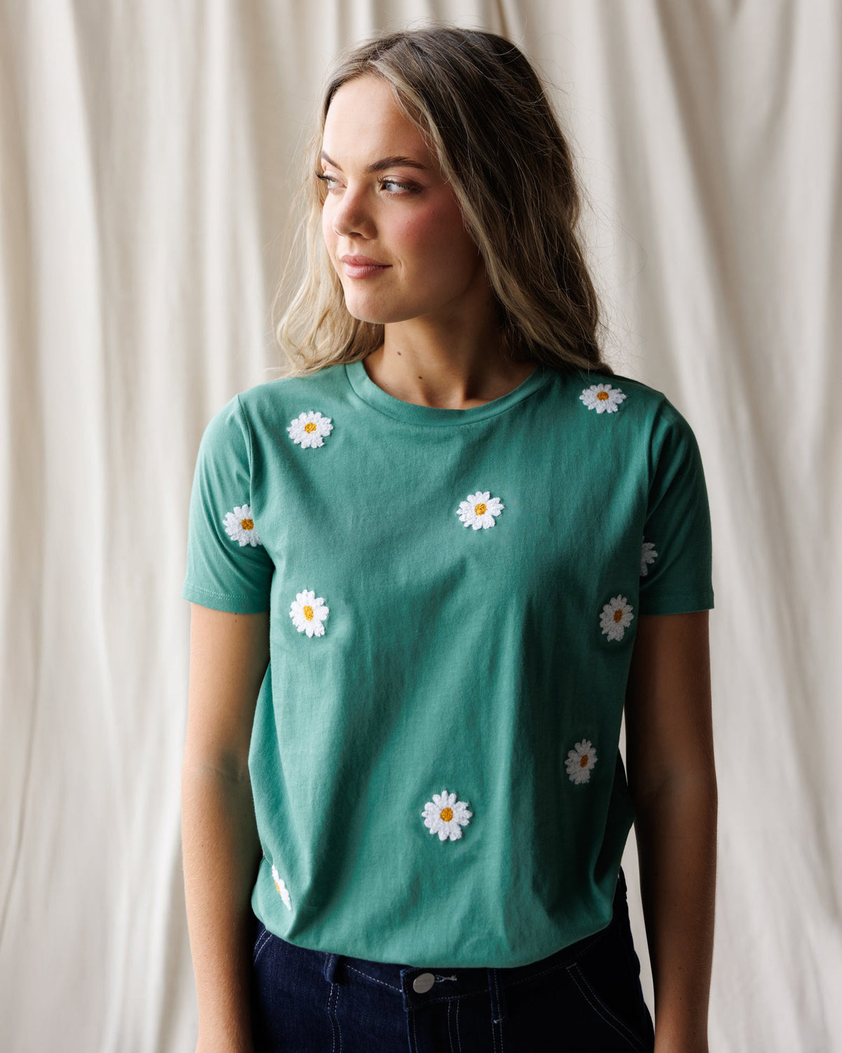 Downeast Pretty Petals Tee, women's casual top with floral print, short sleeves, and relaxed fit, displayed on a hanger.