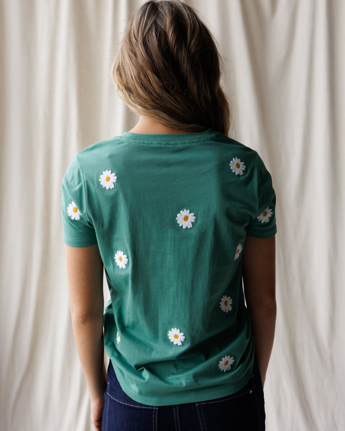 Downeast Pretty Petals Tee showing a floral-printed casual tops with short sleeves and round neckline.