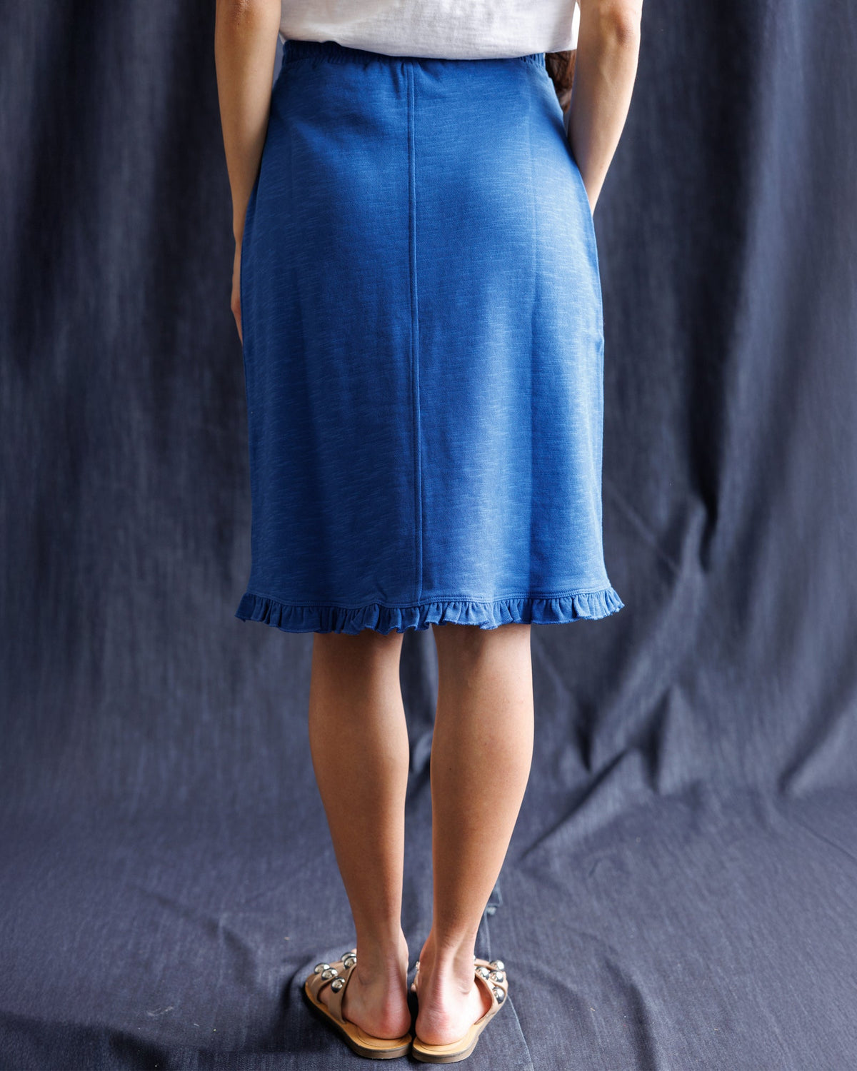 Downeast Perfect Balance Pretty Skirt in floral print, flowing fabric, and knee-length design, displayed on a hanger.