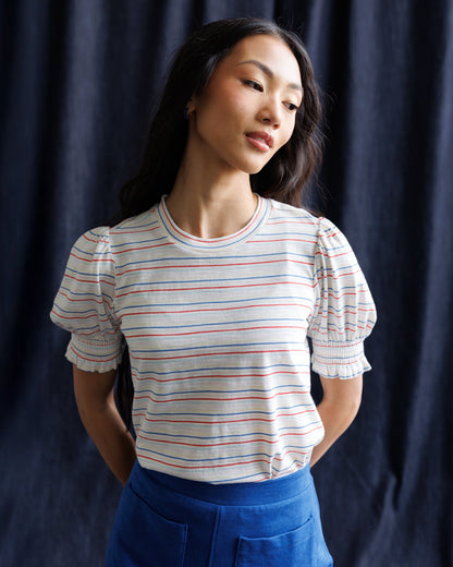 Downeast Tres Belle Top in soft fabric with a stylish neckline, displayed on a hanger.