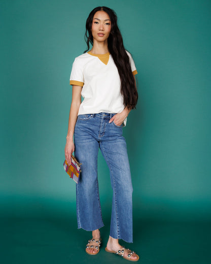 Downeast high rise wide leg denim jeans with a relaxed fit and classic blue wash, shown on a model.