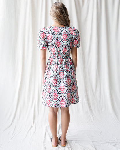 Downeast Capri Dress displayed on a hanger, featuring a flowy, casual dress with a sleeveless design and lightweight fabric.
