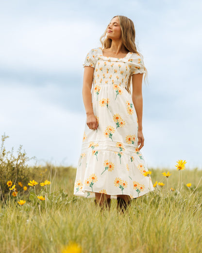 Downeast Arboretum Dress shown on a model, featuring a floral print, lightweight fabric, and a relaxed fit for casual wear.