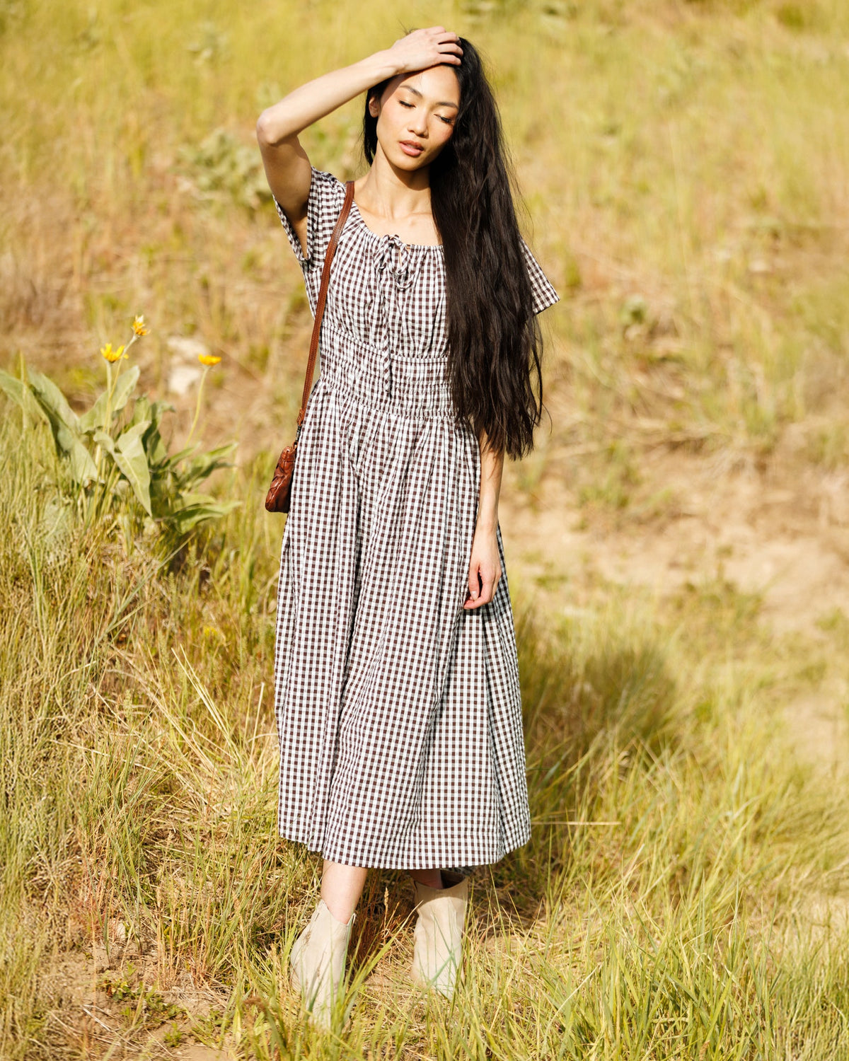Downeast Maybelle Dress featuring a floral print, V-neckline, and short sleeves, displayed on a hanger against a neutral background.