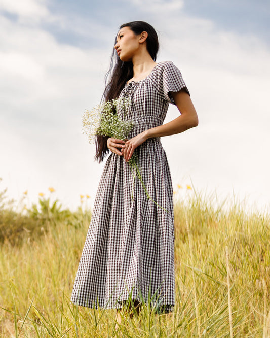 Downeast Maybelle Dress in soft fabric, featuring a flowy silhouette, floral pattern, and short sleeves for a casual elegant look.
