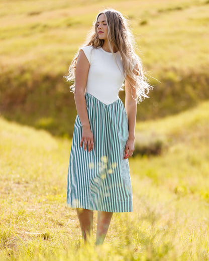 Downeast Valencia Dress with floral pattern, sleeveless design, and lightweight fabric perfect for warm weather.