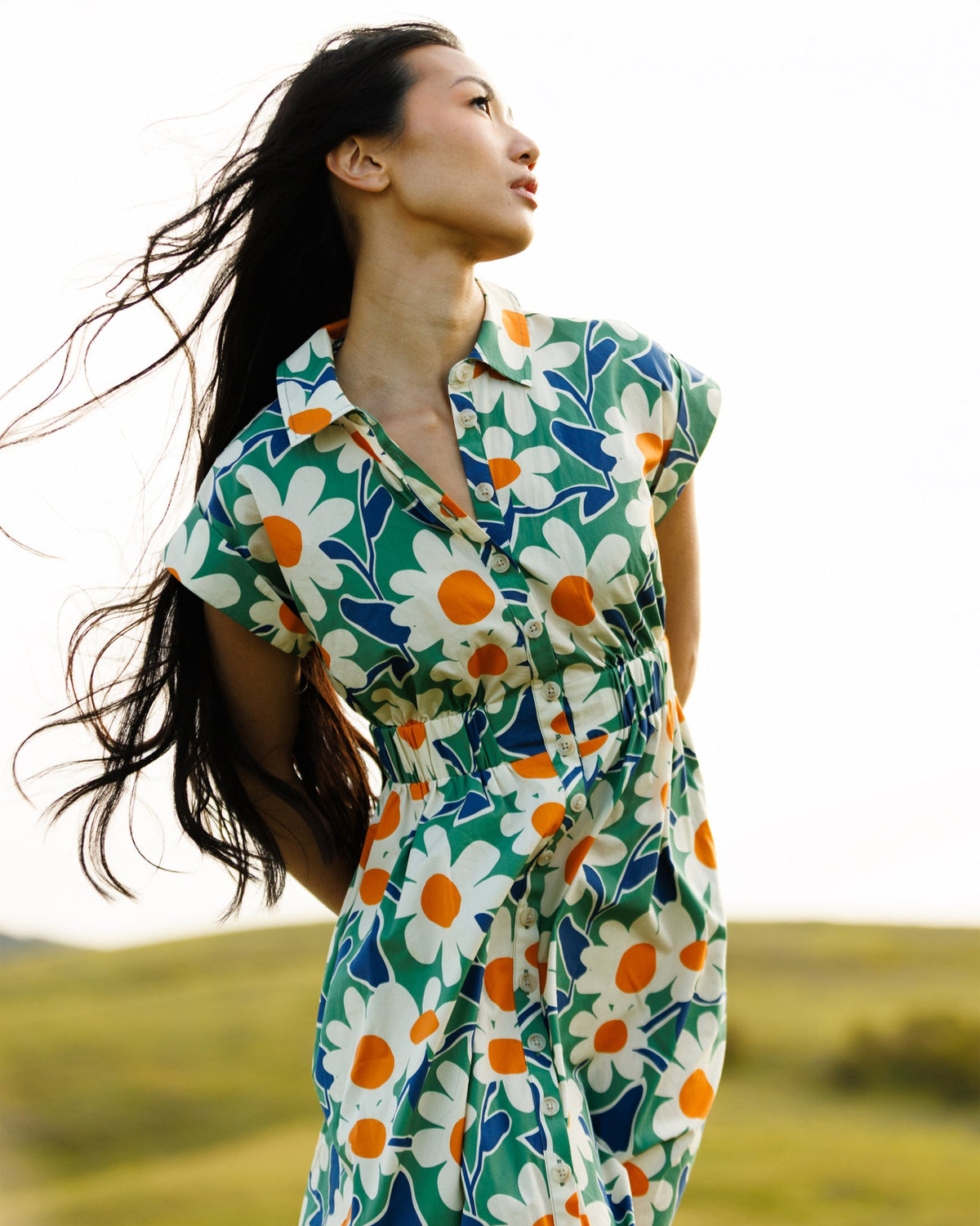 Downeast Newberry Dress in floral print, lightweight fabric, with a relaxed fit and short sleeves, displayed on a hanger.