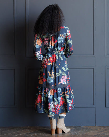 Downeast Wheatland Maxi Dress displayed on a hanger, featuring a flowing fabric and a stylish, relaxed fit for summer wear.