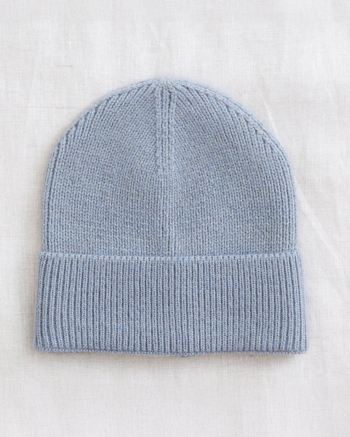 Downeast Alpine Beanie hat in cozy knit, featuring a folded brim and neutral color, perfect for cold weather.