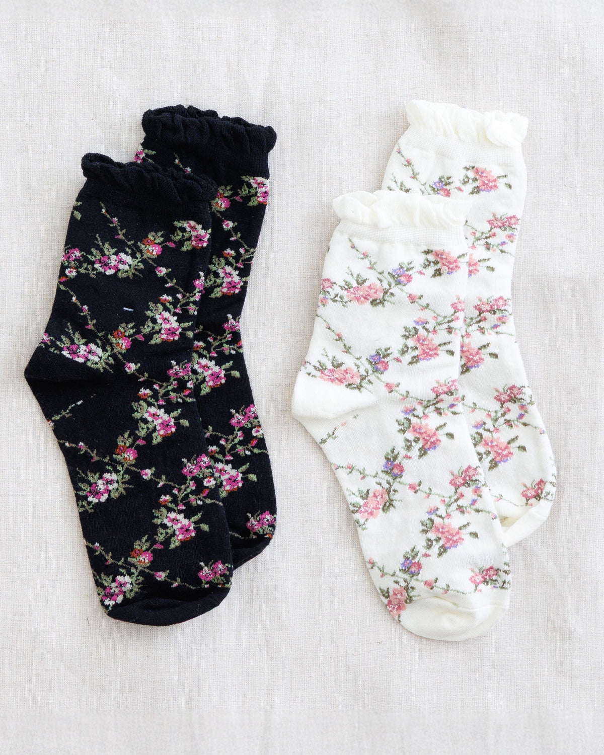 Downeast Le Cute sock set featuring colorful, patterned cotton socks displayed in a neat arrangement.