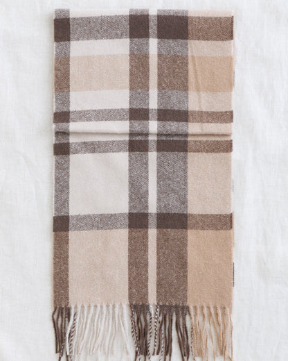Downeast Fireside Scarf showing cozy woven fabric with fringed edges in warm, earthy tones.