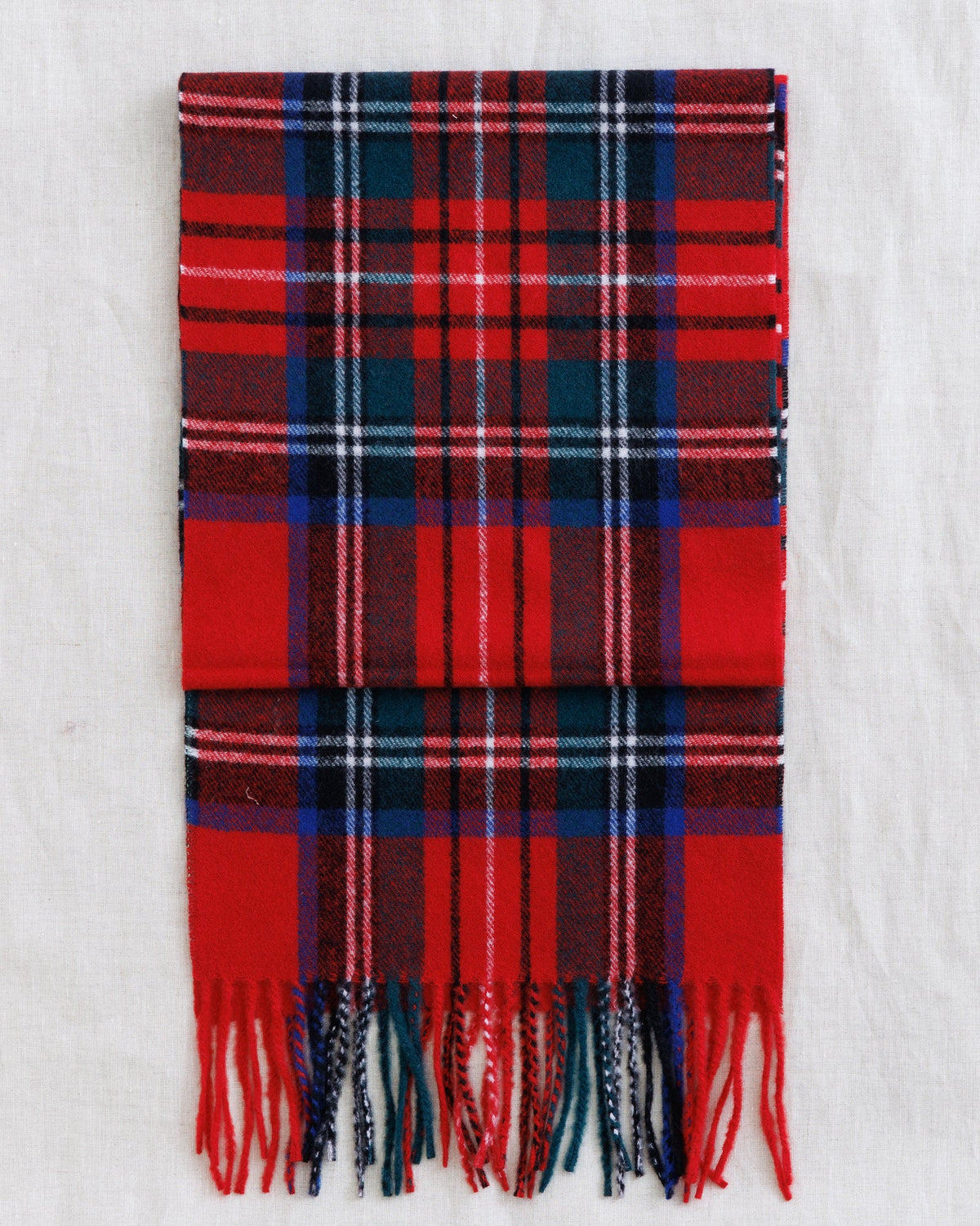 Downeast Solstice scarf featuring vibrant, lightweight fabric with a colorful, floral pattern perfect for stylish fall accessories.