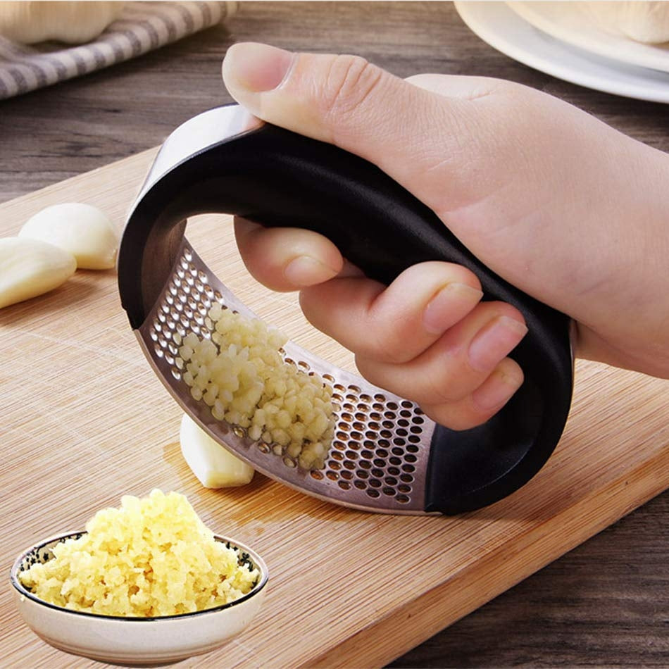 Stainless steel garlic masher and manual garlic press with curved handle for kitchen use