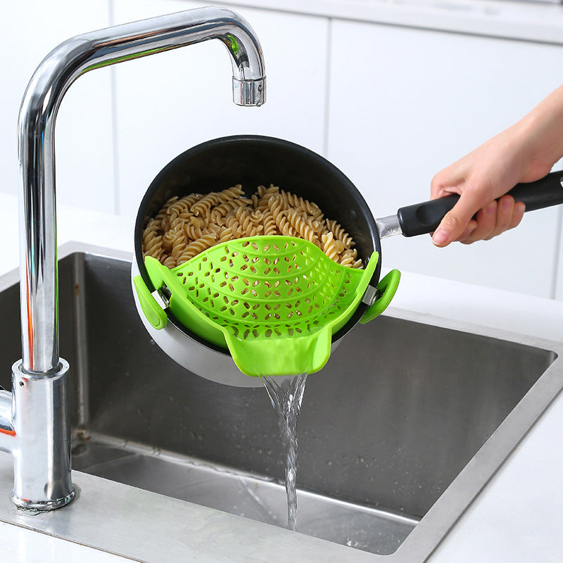 Silicone pot side drain stopper by My Store for securing cookware during pouring