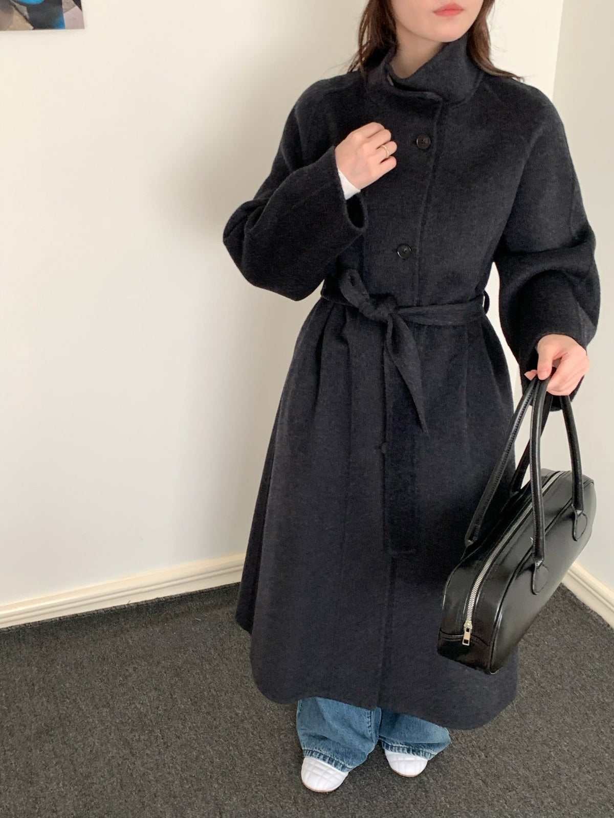 Women's long wool coat with single-breasted design in a classic tailored silhouette
