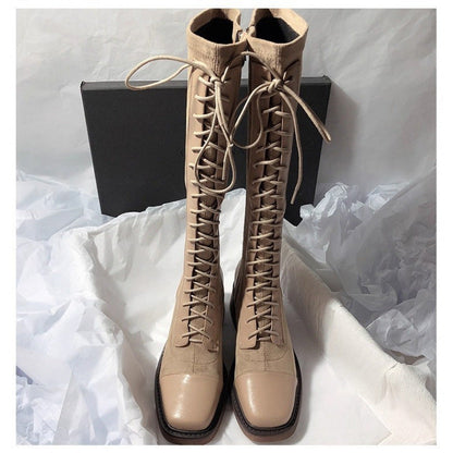 Stitched round-toe lace-up high-top women’s boots in a classic ankle-high design