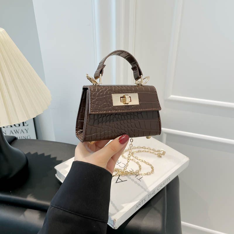 Casual small square handbag with shoulder strap in a compact design, front view