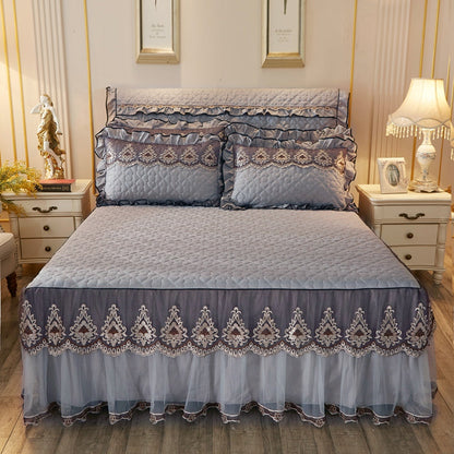 Quilted lace bed skirt bed liner in a textured fabric design; brand not visible