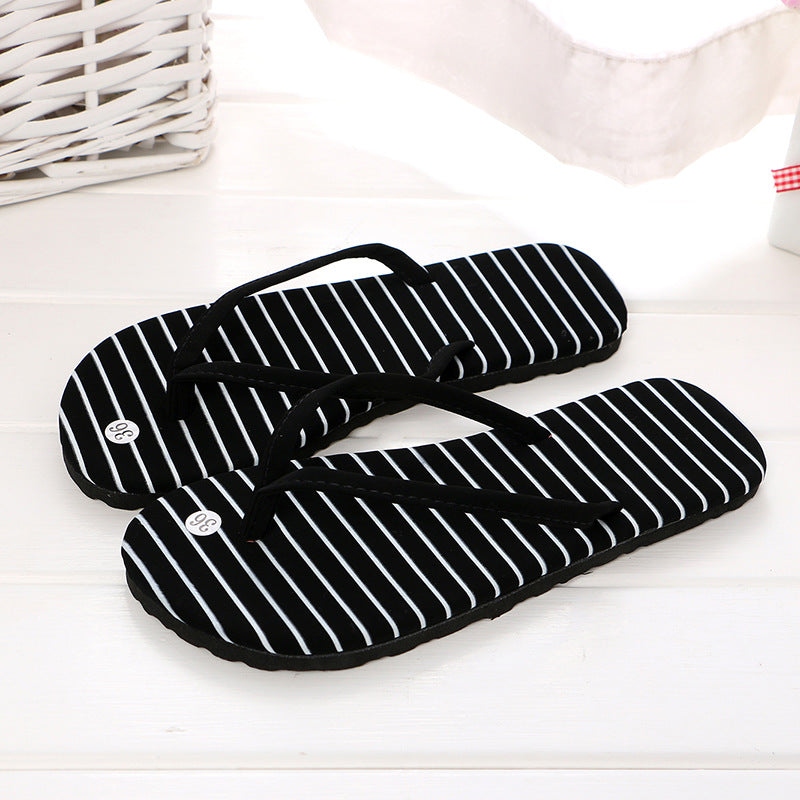 Women's beach flip flops by BACKUPMYFILESNOW.COM® with colorful straps and rubber soles, perfect for casual home or beachwear.