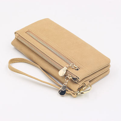 Chic women's long wallet by BACKUPMYFILESNOW® featuring urban style, with multiple card slots and a sleek leather design.